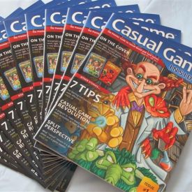 A stack of the first issue of Casual Game Insider